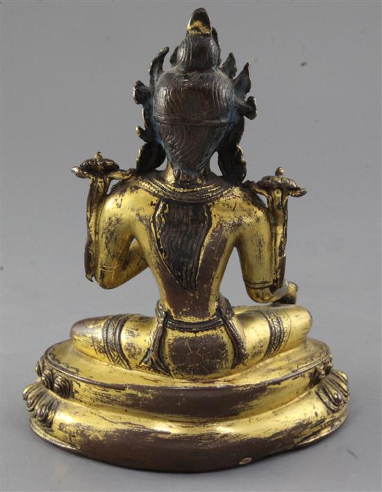 A Tibetan gilt copper alloy figure of Green Tara, 14th-15th century, height 21.3cm